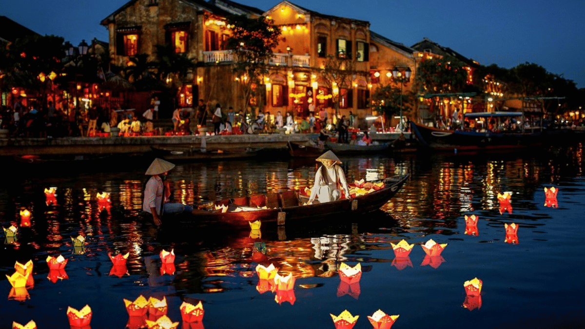 Releasing flower lanterns on Hoai River